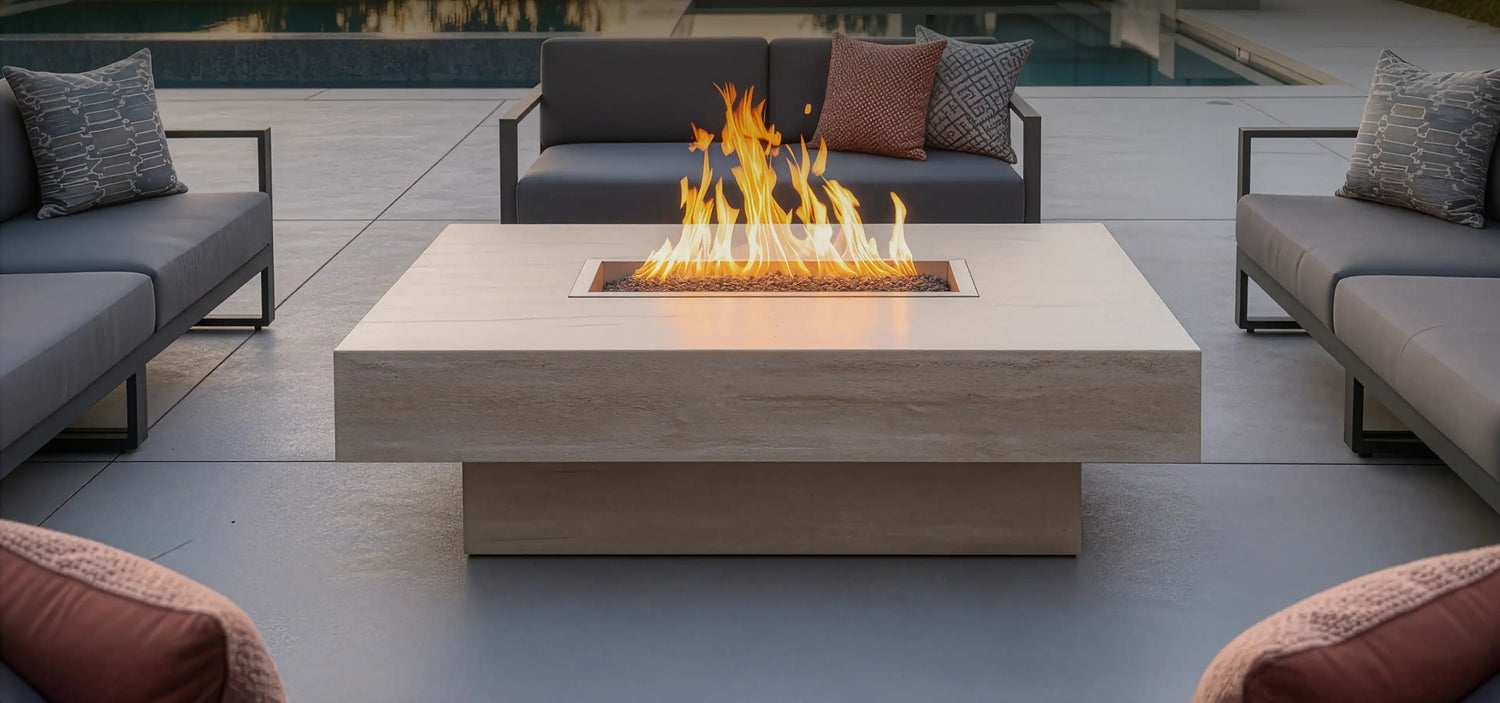 Outdoor patio setting with a fire pit table and surrounding furniture.