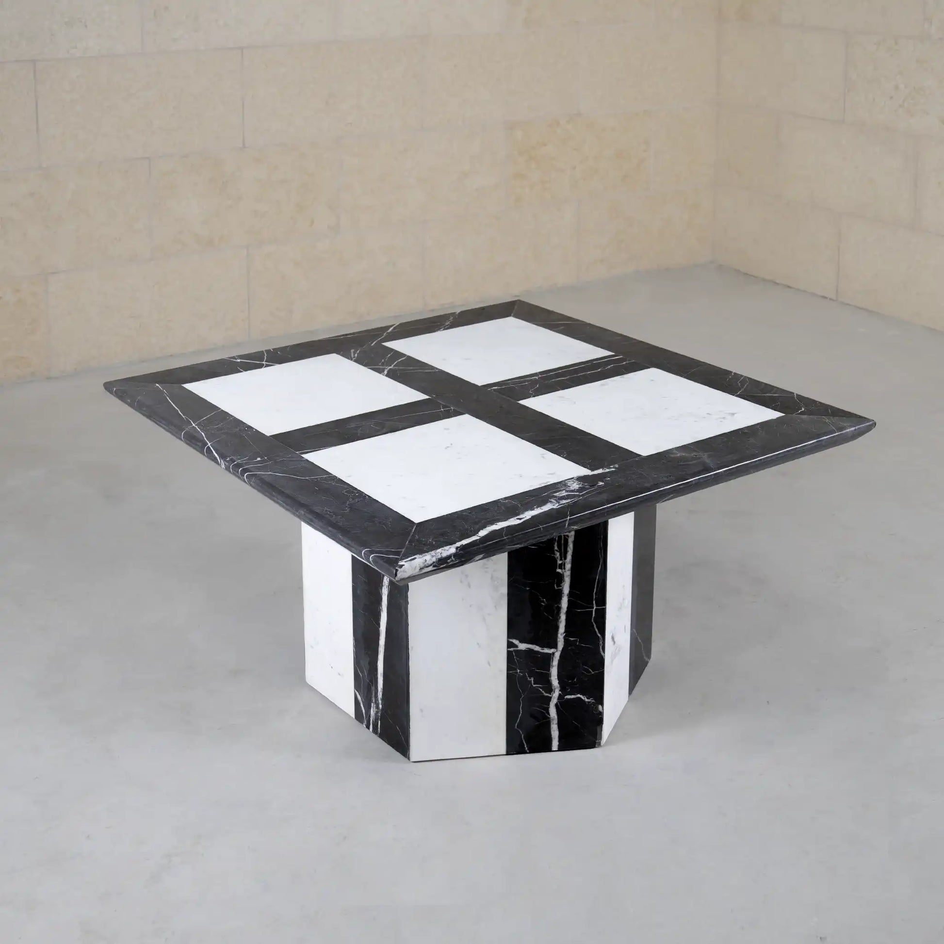 Marble coffee table with black and white pattern on a neutral background