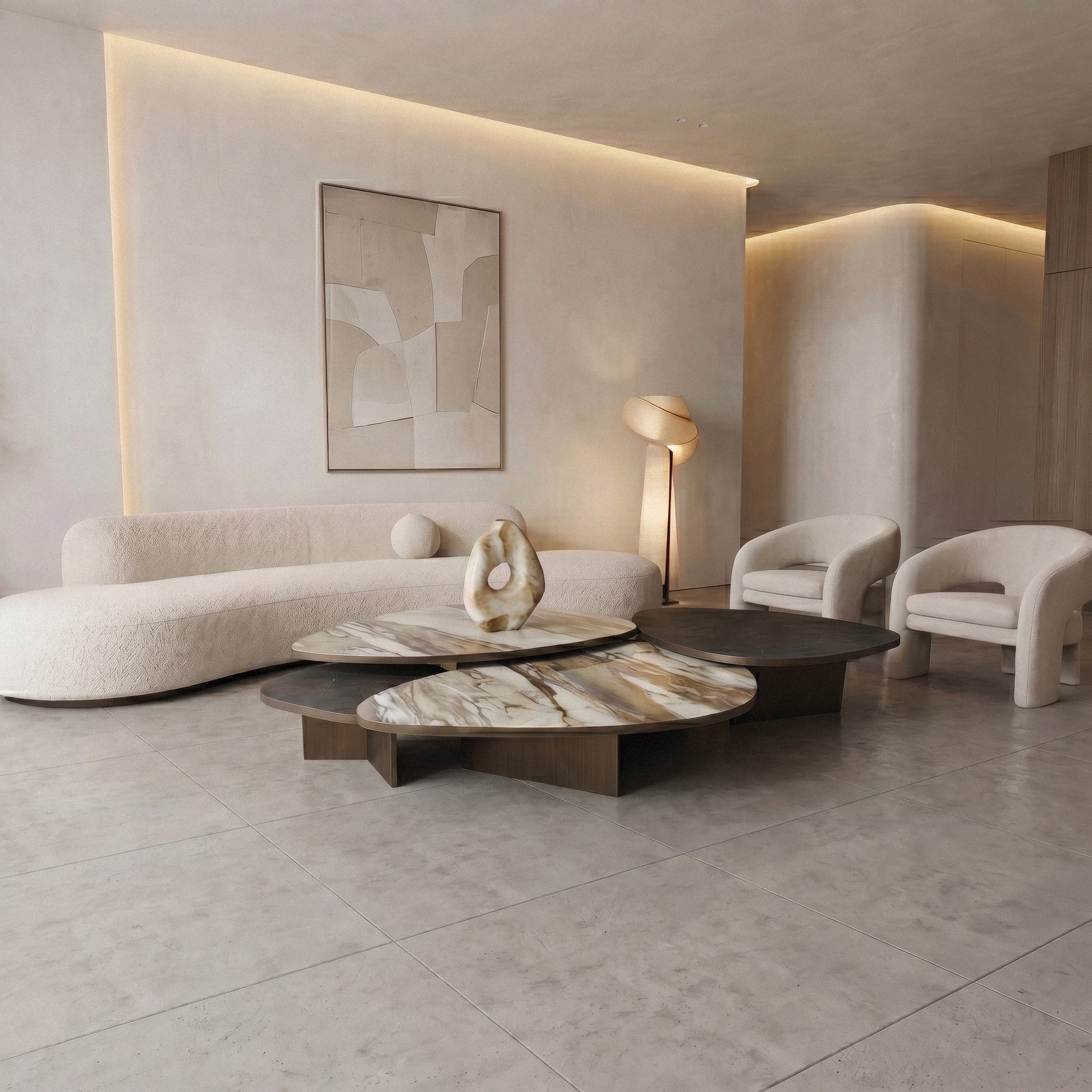 Aurellia marble coffee table in the middle of modern living room with a curved sofa,  and abstract art on the wall.
