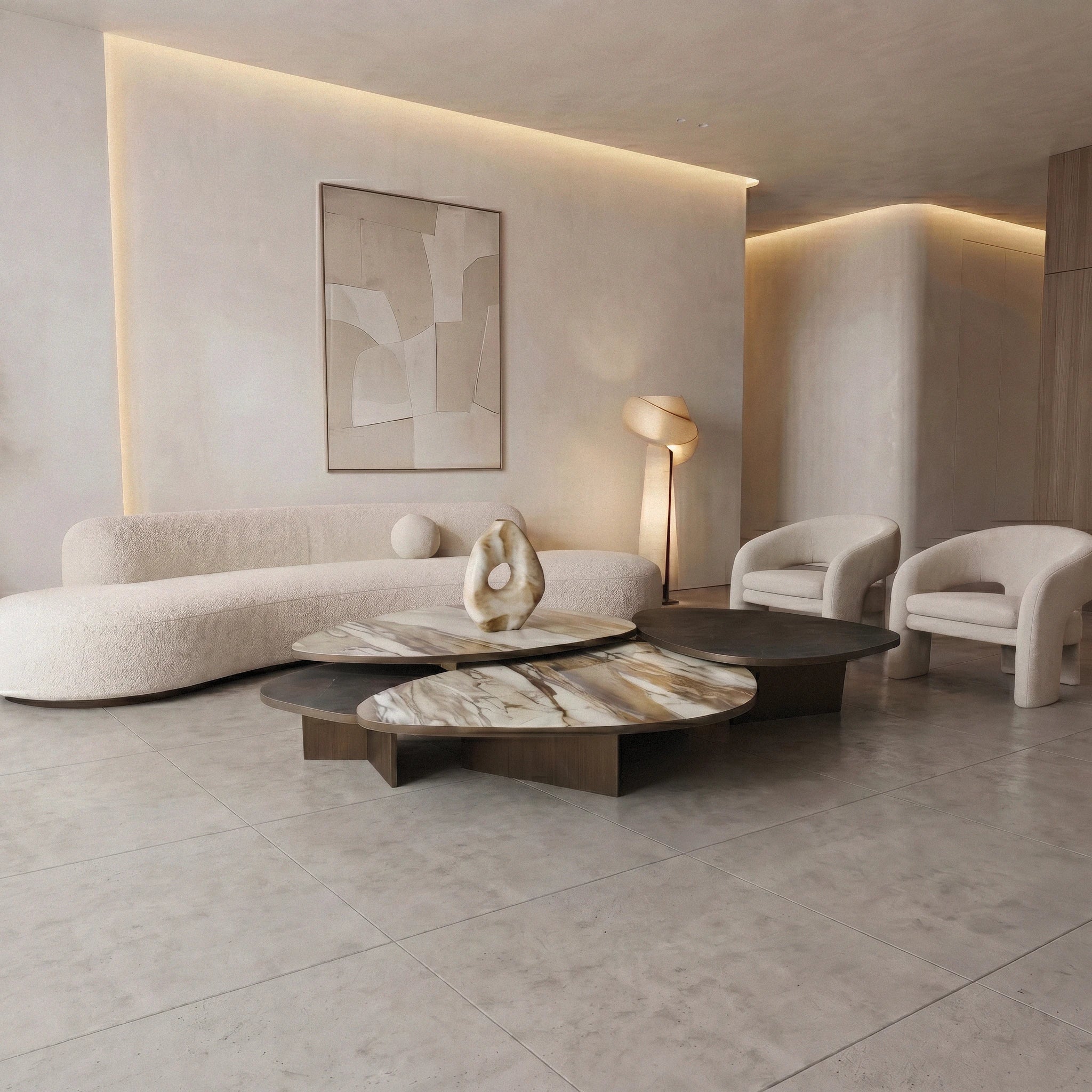 Aurellia marble coffee table in the middle of modern living room with a curved sofa,  and abstract art on the wall.