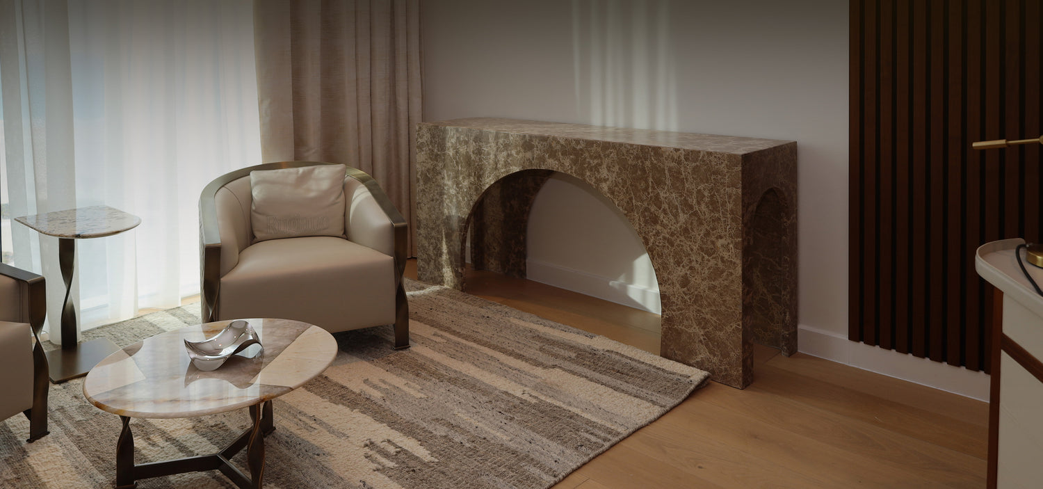 Living room with beige armchair, marble coffee table, and Marble console table.