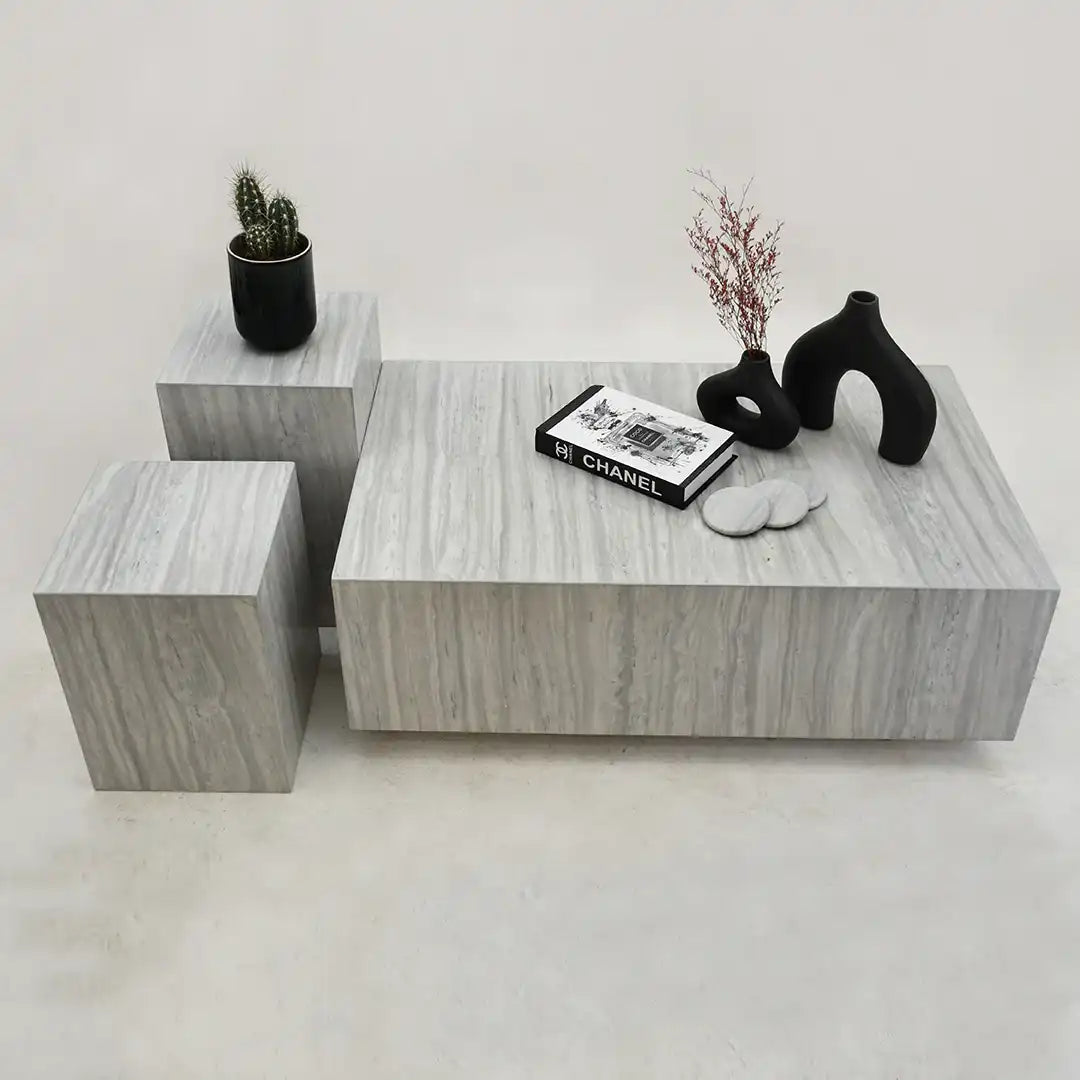 Hugo coffee table set with decorative items on a light gray background