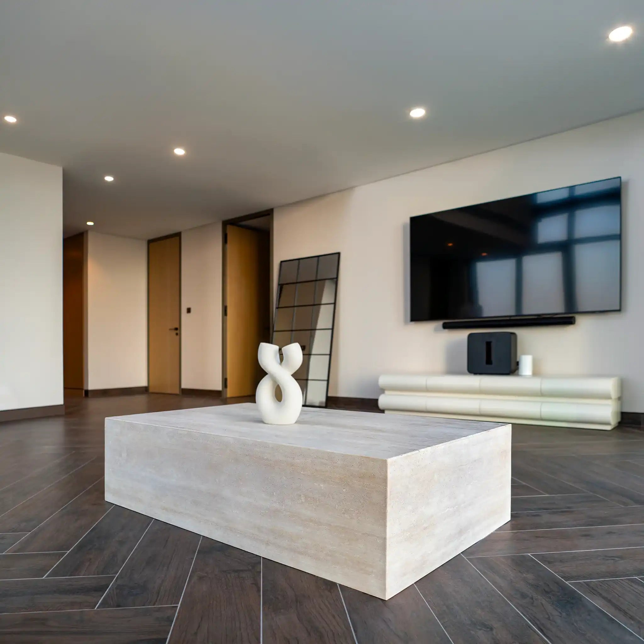 Linea Travertine Coffee Table in Modern living room with a large TV